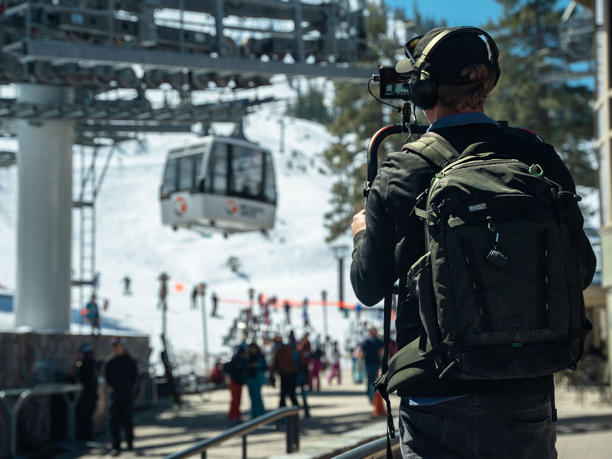 a man is taking a picture of a ski lift
