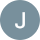 a black and white button with j on it